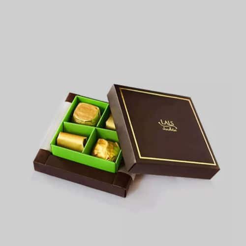 Luxury chocolate box with brown and gold design, featuring green tray dividers